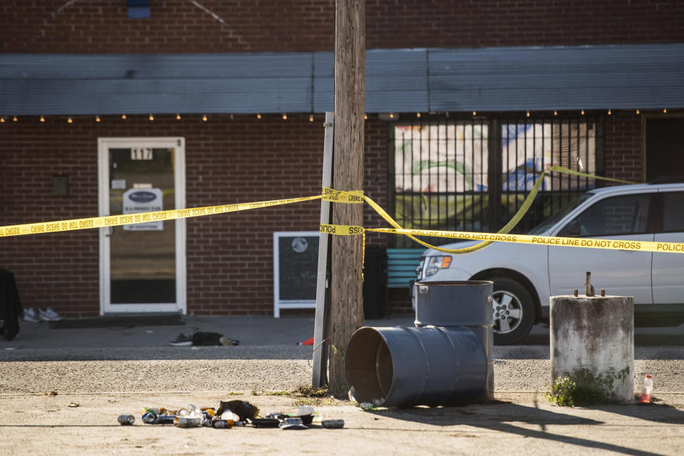 Crime scene tape stretches in front of Mac's Lounge, the scene of an early morning bar shooting, Sunday, Jan. 26, 2020, in Hartsville, S.C. (AP Photo/Sean Rayford)