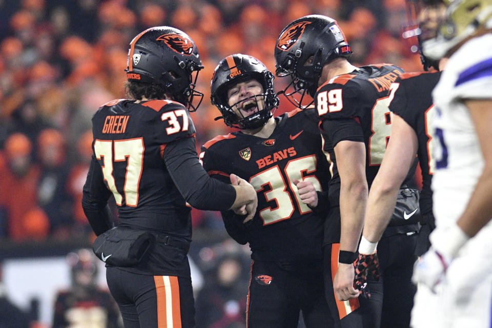 Oregon State place-kicker Atticus Sappington (36) celebrates a field goal against Washington with Josh Green (37) and Bryce Caufield (89) during the second half of an NCAA college football game Saturday, Nov. 18, 2023, in Corvallis, Ore. Washington won 22-20. (AP Photo/Mark Ylen)