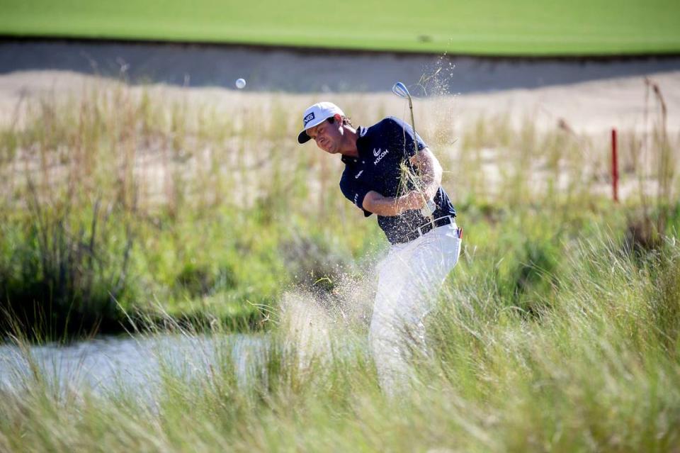 Harris English hits out of the bunker on the 18th green during the final round of the Palmetto Championship golf tournament in Ridgeland, S.C., Sunday, June 13, 2021. (AP Photo/Stephen B. Morton)