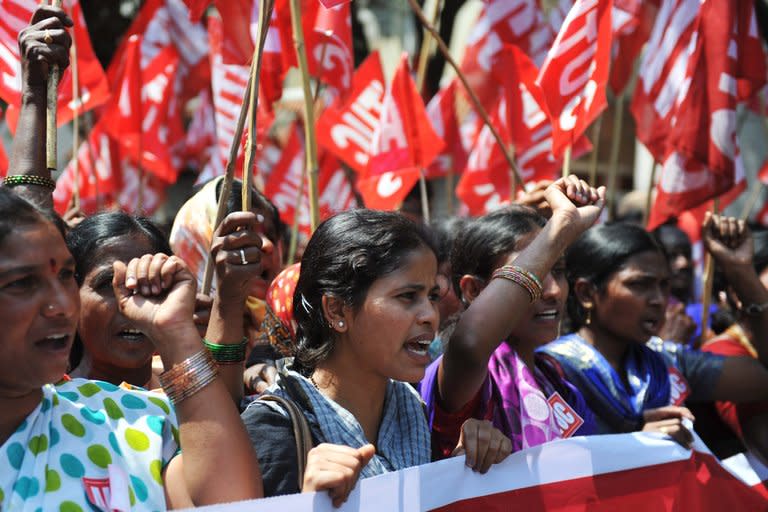 Indian workers rally during a two-day strike called by trade unions opposing the government's economic policies in Hyderabad on February 20, 2013. Millions of India's workers walked off their jobs on Wednesday in a two-day nationwide strike called by trade unions to protest at the "anti-labour" policies of the embattled government