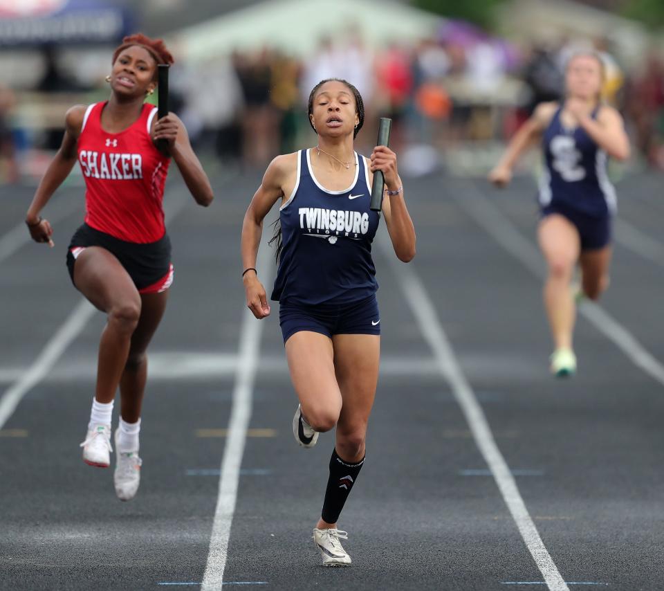 Twinsburg's Arriah Gilmer leads the pack in the girls 4x200 meter relay race during the Division I regional track and field meet at Austintown Fitch High School on Friday.