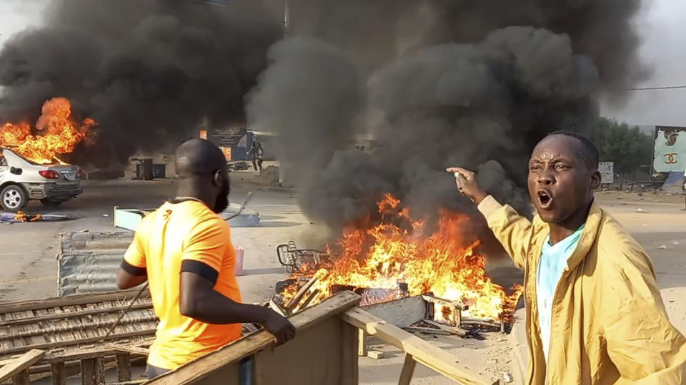 Anti-government demonstrators set a barricade on fire during clashes in N'Djamena, Chad, Thursday Oct. 20, 2022. Chadian security forces have opened fire on anti-government demonstrators in the country's two largest cities killing at least 60 people, the government spokesman and a morgue official said. Authorities imposed a curfew after Thursday's violence, which came amid protests in the central African nation against interim leader Mahamat Idriss Deby's two-year extension of power. (AP Photo)