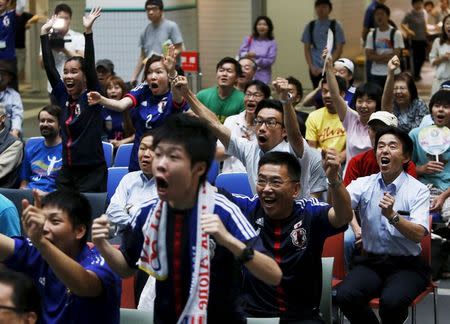 Japan's soccer fans react after an own goal by England during their FIFA Women's World Cup semi-final soccer match, at a public viewing event in Tokyo, Japan, July 2, 2015. REUTERS/Yuya Shino