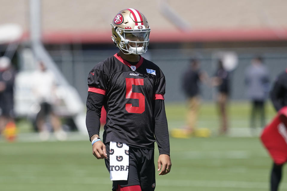 San Francisco 49ers quarterback Trey Lance (5) smiles while taking part in drills at the NFL football team's practice facility in Santa Clara, Calif., Tuesday, June 7, 2022. (AP Photo/Jeff Chiu)