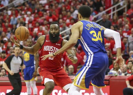 May 6, 2019; Houston, TX, USA; Houston Rockets guard James Harden (13) attempts to control the ball as Golden State Warriors guard Shaun Livingston (34) defends during the fourth quarter in game four of the second round of the 2019 NBA Playoffs at Toyota Center. Mandatory Credit: Troy Taormina-USA TODAY Sports