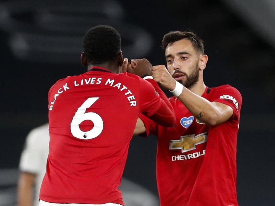 Pogba and Fernandes celebrate after United equalise: Getty