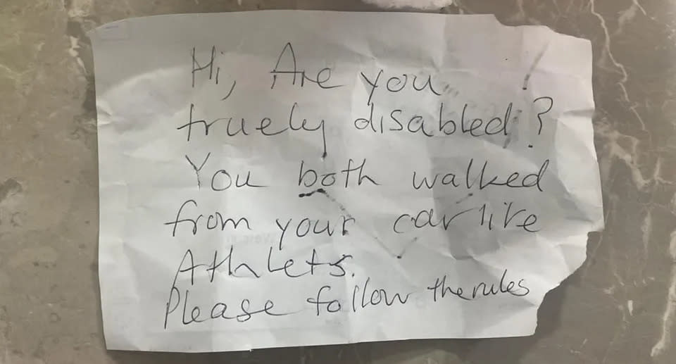 A handwritten note was left on a woman in Canberra's car which had been parked in a disabled parking spot. Source: Supplied