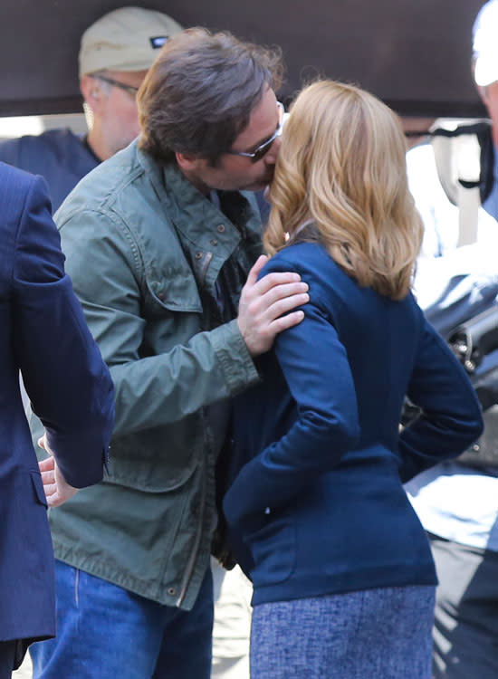 Just when we thought we couldn't be any more excited about Fox's upcoming <em>X-Files</em> revival, something comes along that fills us with even more anticipation! On Tuesday, series stars David Duchovny and Gillian Anderson reunited on set where the co-stars made the hearts of all <em>X-Files</em> fans beat faster when they shared a sweet kiss. Splash News <strong>WATCH: 'X-Files' Stars David Duchovny and Gillian Anderson Share a Kiss on Stage! </strong> It's unclear if the kiss was a friendly hello, or part of a scene. To be fair, it's never been that hard for Duchovny and Anderson to make <em>X-Files</em> fans swoon. Like when they kissed on stage last month at a live performance of Duchovny's debut album. That caused quite the stir among fans. <strong>NEWS: David Duchovny Clears Up Gillian Anderson Dating Rumors: 'It's Not Going to Happen' </strong> On Monday, Anderson really stoked the fandom flames when she tweeted a picture of two set chairs with "Mulder" and "Scully" embroidered on the backrests, as well as the message, "And so it begins..." And so it begins... pic.twitter.com/FSDI7W0bMK— Gillian Anderson (@GillianA) June 9, 2015 Adding to that excitement, Duchovny tweeted another picture of his chair, this time with a script sitting on it. Look closely even in the dark you see pic.twitter.com/Q1FUlxIH8h— David Duchovny (@davidduchovny) June 9, 2015 <strong>NEWS: Dana Scully Is Back! Gillian Anderson Dyes Hair Red for 'The X-Files' Reboot </strong> <em>X-Files</em> creator Chris Carter, who is also helming the revival, joined Instagram to celebrate and document the production. He commemorated the start of principal photography with his very first post, sharing a pic of a slate. Premiering in 1993, <em>X-Files</em> came to an end in 2002 after nine seasons and two feature films in 1998 and 2008. The popular series earned 16 Emmys, five Golden Globes and a Peabody Award. <strong>PHOTOS: The '90s Are Back! Retro Reboots Coming to Your TV </strong> The six-part limited series revival returns to Fox on Jan. 24, 2016. Last week, Anderson made headlines when she wore a sheer, nude-colored gown to the Glamour UK Women of the Year Awards, and ended up showing a little more than she bargained for. Check out the video below to see how she managed to stay classy, even during a slight wardrobe malfunction.