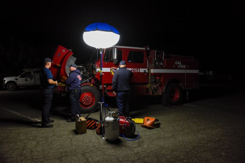 Cal Fire Mobile Mechanics inspect a fire truck used to fight the Kincade Fire at the Cal Fire basecamp in Santa Rosa