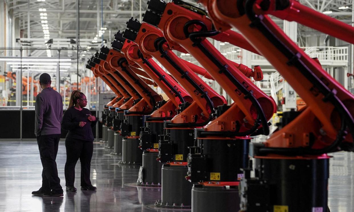 <span>Robotic arms for an assembly line at a Mercedes-Benz electric vehicle battery factory near Vance, Alabama, in 2022.</span><span>Photograph: Elijah Nouvelage/Reuters</span>