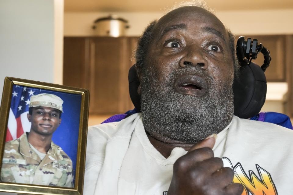 A portrait of American soldier Travis King is displayed as his grandfather, Carl Gates, talks about his grandson Wednesday, July 19, 2023, in Kenosha, Wis. Pvt. King bolted into North Korea while on a tour of the Demilitarized Zone on Tuesday, July 18, a day after he was supposed to travel to a base in the U.S. (AP Photo/Morry Gash)