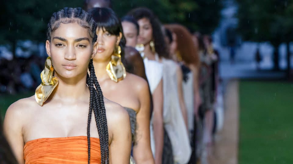 Oversized gold earrings were a statement accessory peppered throughout Prabal Gurung's collection. The sinuous and sensuous pieces looked like, well, liquid gold, as if they were dripping from the models' jawlines. - Victor Virgile/Gamma-Rapho/Getty Images