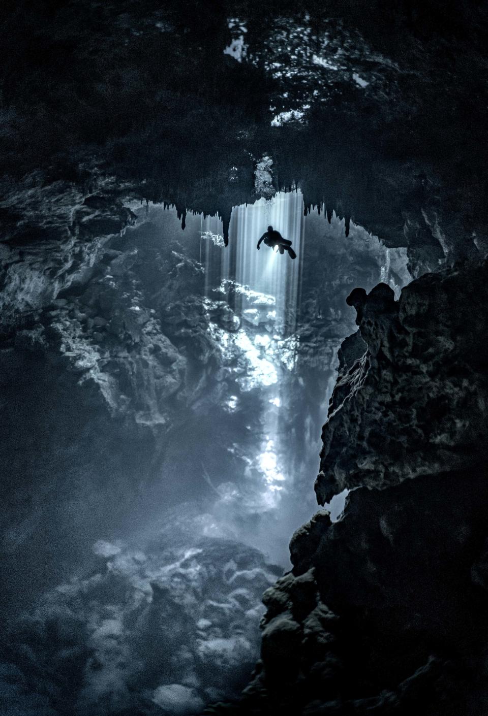 A diver in an underwater cave in the Riviera Maya, Mexico. (Martin Broen/Caters News)