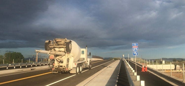 A concrete truck drives on the newly rebuilt Kechter Road over Interstate 25 in southeast Fort Collins on Wednesday. The road was rescheduled to reopen later that day after being closed more than a month due to construction.