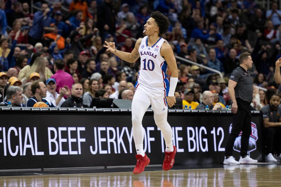 Kansas forward Jalen Wilson celebrates after a 3-pointer against Iowa State during their game at T-Mobile Center in Kansas City, Missouri, on March 10, 2023.