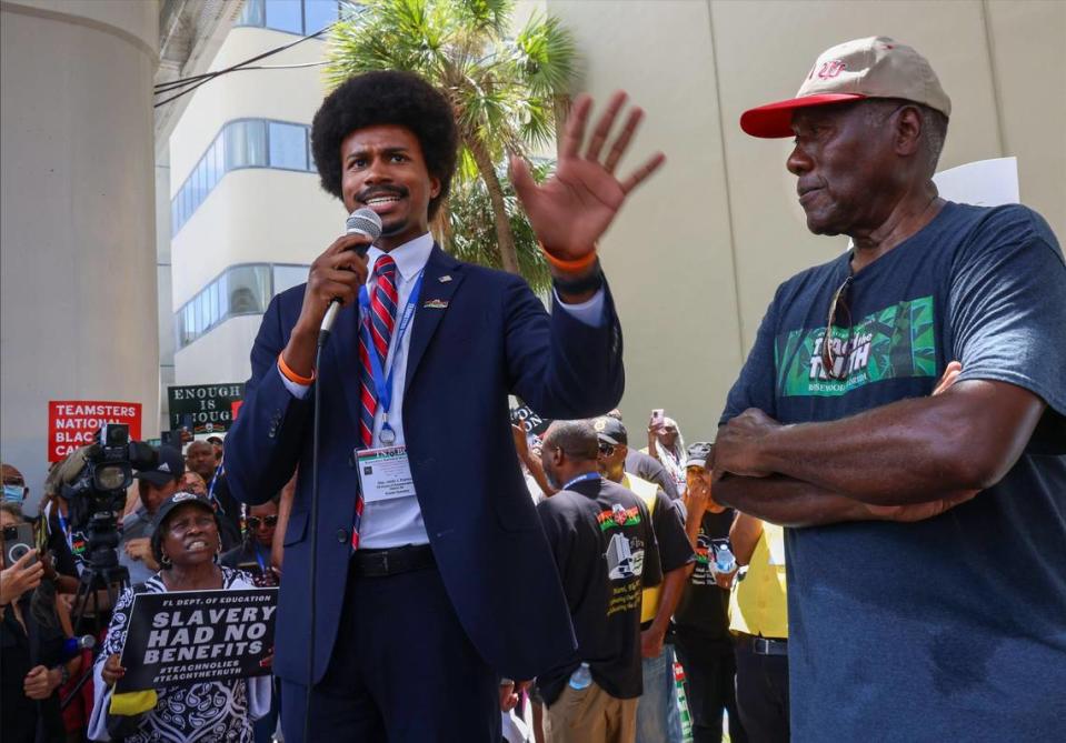 Tennessee State Rep. Justin Pearson, a Democrat, left, addresses the impact of Florida’s new Black history education guidelines regarding the teaching of slavery during the demonstration outside the Miami-Dade Public Schools administration building, Wednesday, Aug. 16, 2023. About 350 people were protesting the new African American history standards approved by the state in July. On the right is Marvin Dunn.