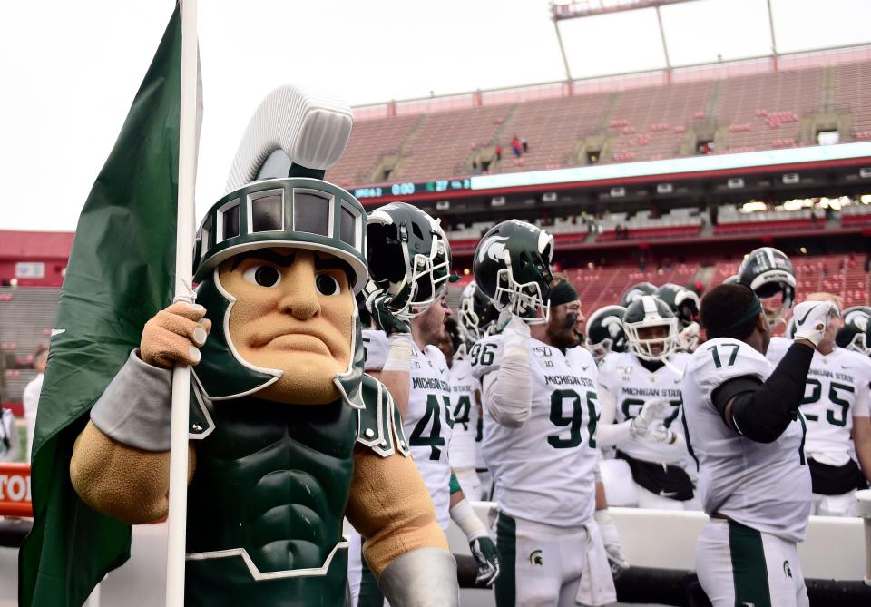 Sparty and the Michigan State Spartans sing the alma mater after their 27-0 win over Rutgers, Nov. 23, 2019 in Piscataway, New Jersey.