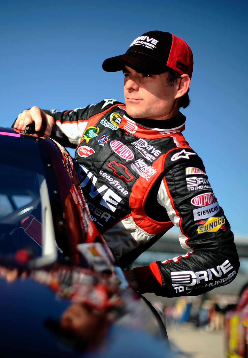 FORT WORTH, TX - NOVEMBER 04: Jeff Gordon, driver of the #24 Drive to End Hunger Chevrolet, climbs from his car after qualifying for the NASCAR Sprint Cup Series AAA Texas 500 at Texas Motor Speedway on November 4, 2011 in Fort Worth, Texas. (Photo by Jared C. Tilton/Getty Images for NASCAR)