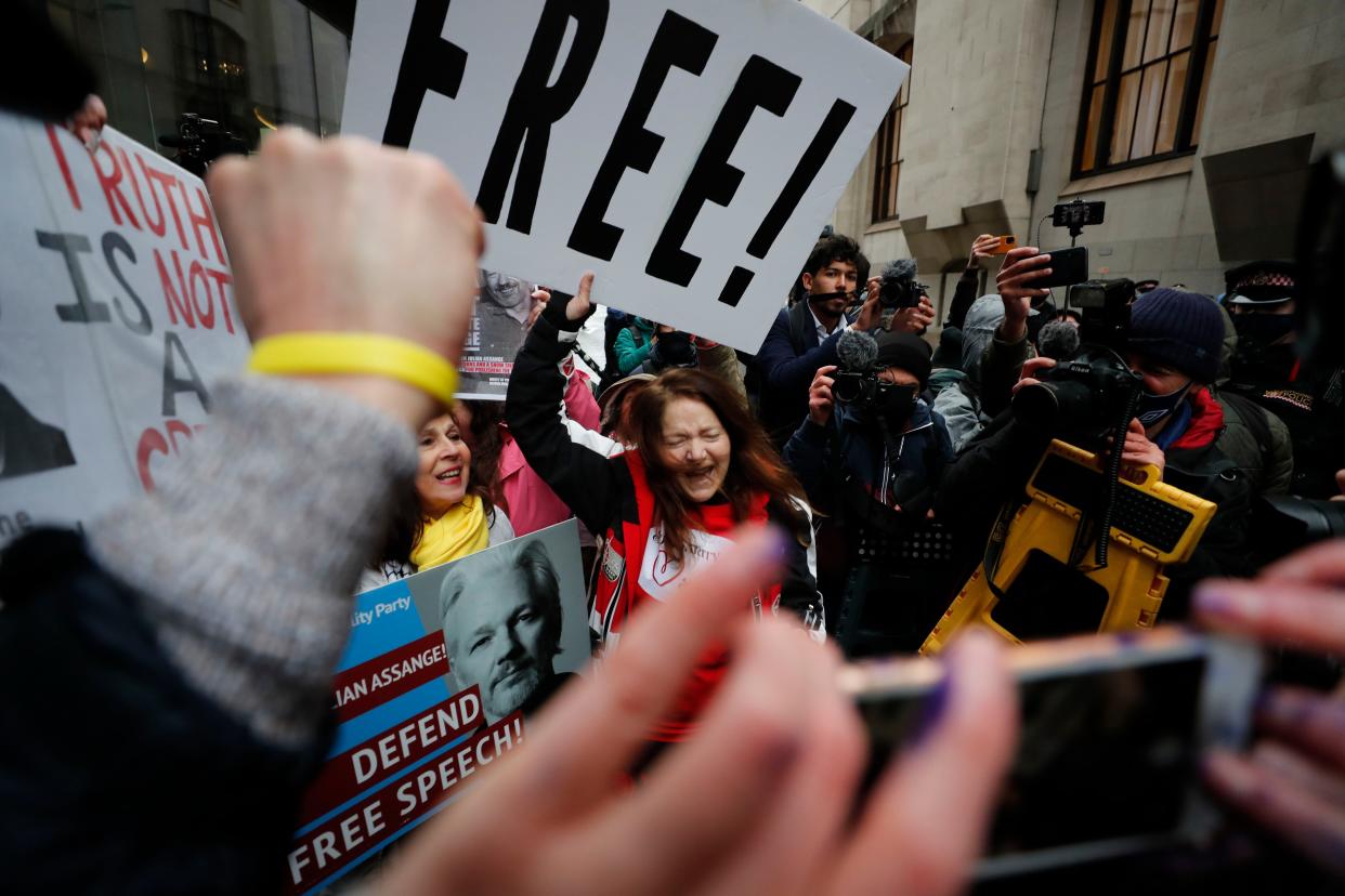 Julian Assange supporters celebrate after a ruling that he cannot be extradited to the United States outside the Old Bailey in London on Monday, Jan. 4, 2021.