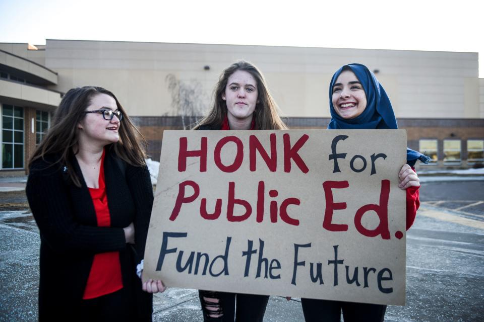 Haley Morton, Victoria Booth and Sonndos Abballa protest a lack of funding for education by the state during a walk-in on Wednesday, Feb. 26, 2020 at Harrisburg High School. 