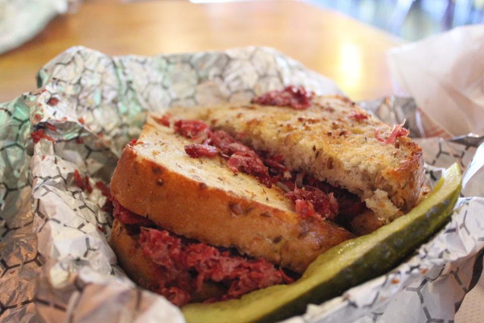 The Royal Tenenbaum's extra thick rye bread holds its fillings — sauerkraut and corned beef — at Mr. Zub's Deli and Bar in Akron's Highland Square.