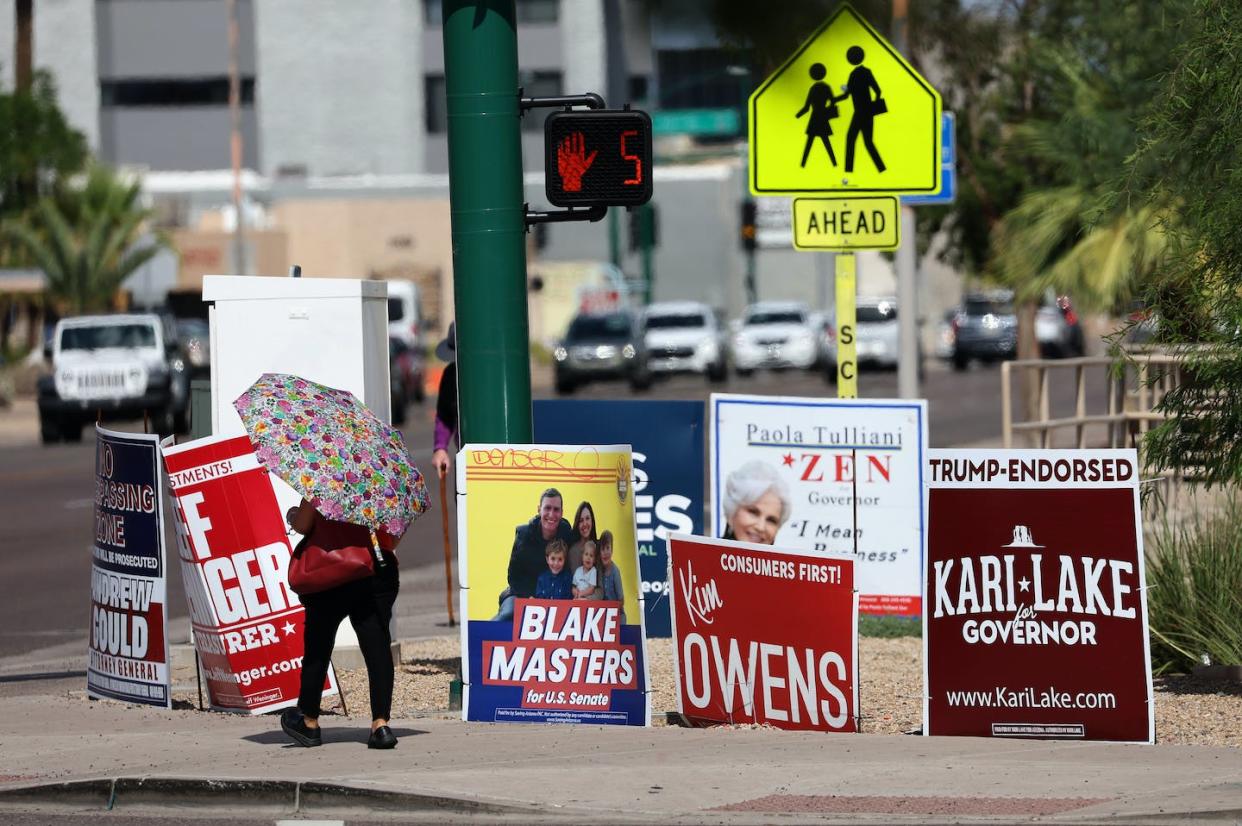 Arizona's cities and towns have been flooded with signage during the heavily contested 2022 elections. <span>Justin Sullivan/Getty Images</span>