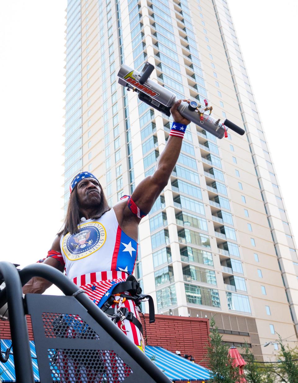 Terry Crews, in character as President Camacho from "Idiocracy," holds a T-shirt gun after announcing his run for president Saturday at South by Southwest.