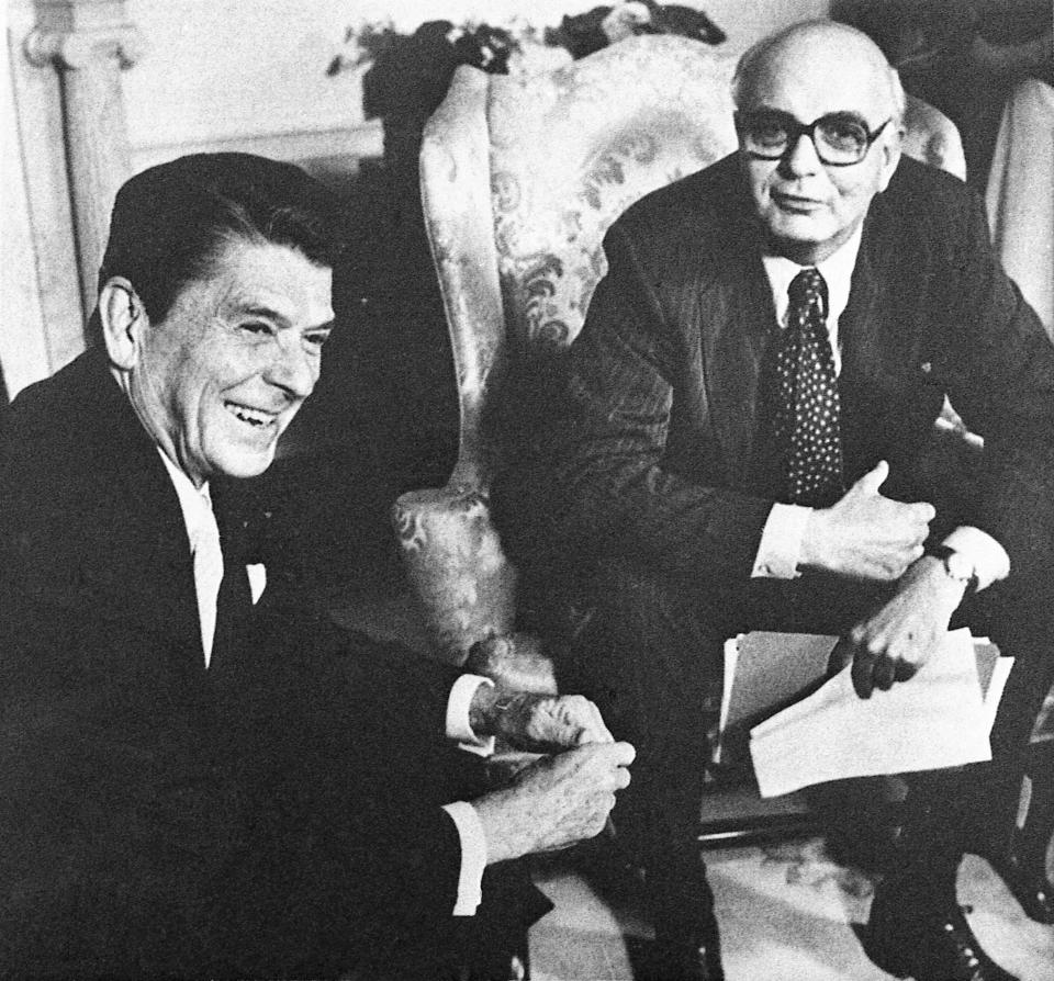 FILE - In this July 16, 1981, file photo Federal Reserve Board chairman Mr. Paul Volcker, right, meets with President Ronald Reagan in the Oval Office in Washington. Volcker, the former Federal Reserve chairman died on Sunday, Dec. 8, 2019, according to his office, He was 92. (AP Photo/J. Scott Applewhite File) ORG XMIT: NYBZ164