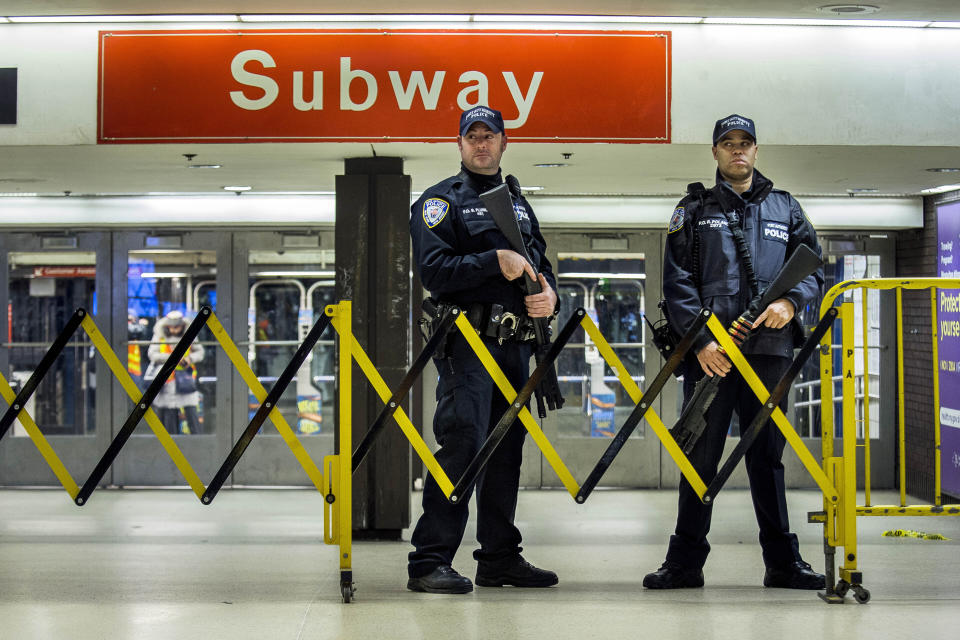 FILE - In this Dec. 11, 2017 file photo, police stand guard inside the Port Authority Bus Terminal following an explosion near Times Square, in New York. Akayed Ullah, a Bangladeshi immigrant whose subway pipe bomb mostly misfired, was sentenced Thursday, April 22, 2021, to life in prison for the 2017 attack in New York City busiest station. (AP Photo/Andres Kudacki, File)