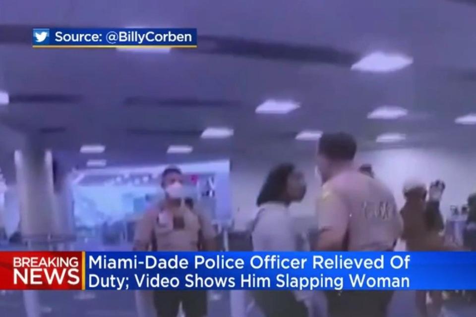 A Miami-Dade police officer was caught on camera slapping a woman: @BillyCorben/CBS News