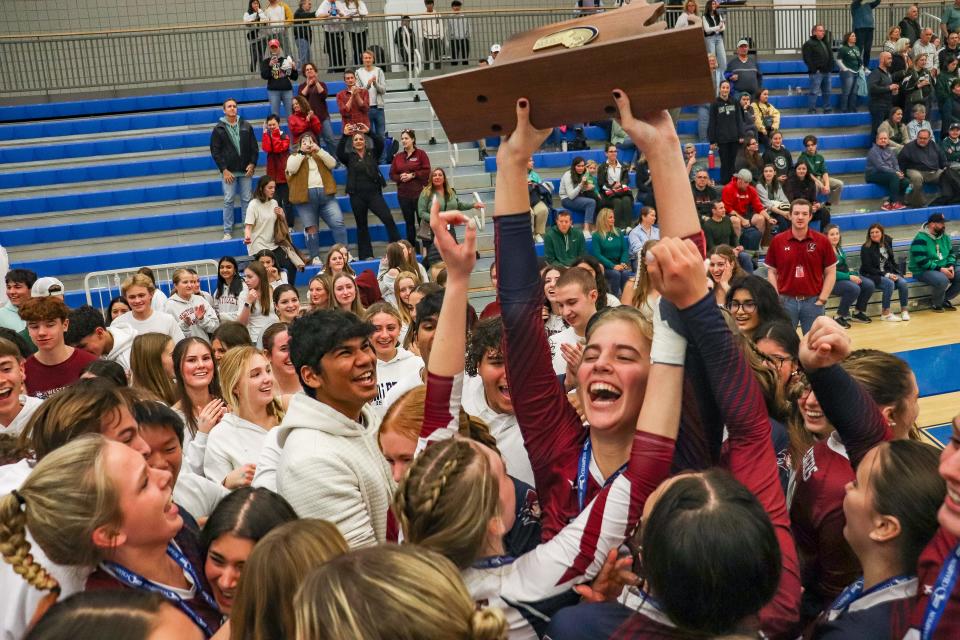 Westborough's Maggie Cardin hoists the trophy after winning the Division 2 state championship game vs. Canton at Worcester State University on Saturday, Nov. 18, 2023.