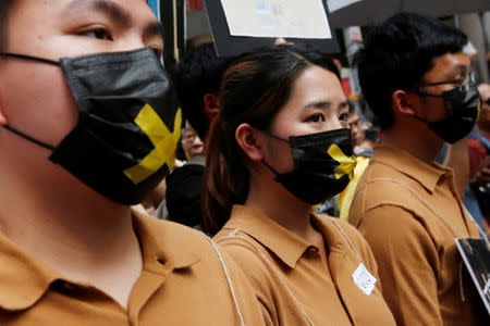 Protesters dressed as political prisoners take part in a march in Hong Kong, China, July 1, 2018, the day marking the 21st anniversary of the city's handover to Chinese sovereignty from British rule. REUTERS/Bobby Yip