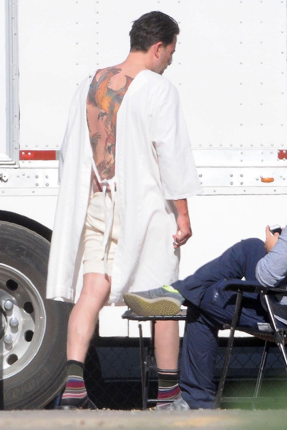 Affleck reveals his tattoo on the set of "Live By Night" on Dec. 8, 2015.&nbsp; (Photo: BACKGRID)