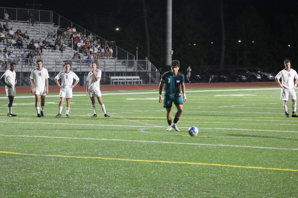Evan Narvaez seconds before converting a penalty kick in a win over Benedictine on April 9, 2024.