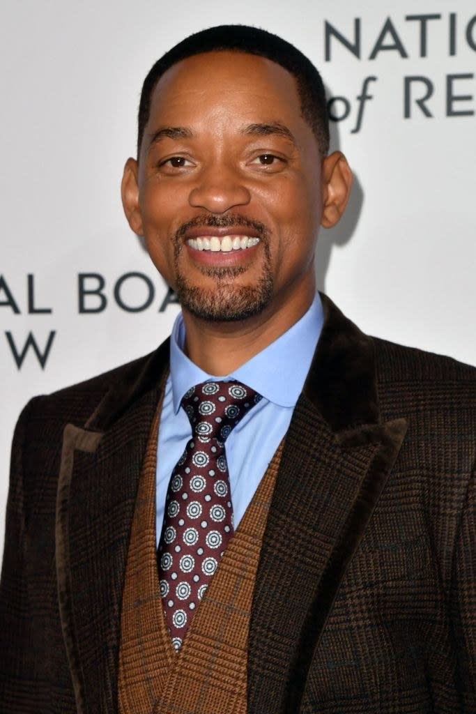 Close-up of smiling Will in a suit and tie