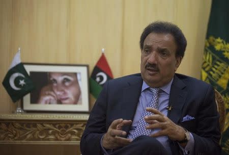 Pakistan&#39;s Interior Minister Rehman Malik speaks during an interview with Reuters.