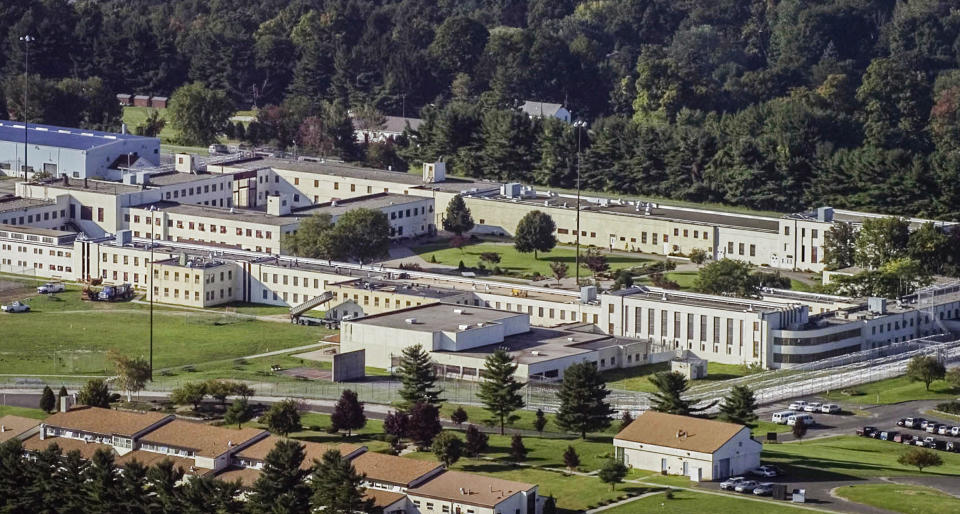 FILE - An aerial view captures the Danbury Connecticut Federal Correctional Institute Sept. 24, 2004. Connecticut correctional officers are still waiting for the "hero pay" from $22.5 million in federal pandemic funds, set aside for essential state employees and members of the Connecticut National Guard who worked long hours during the COVID-19 pandemic. (AP Photo/Douglas Healey, File)