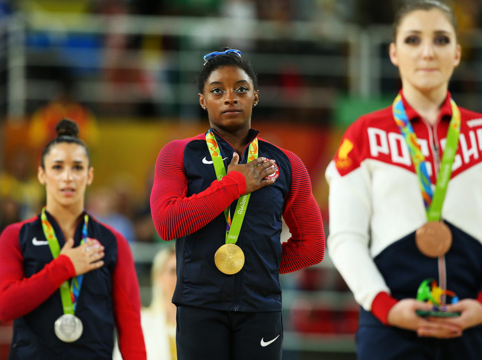 Simone Biles, centre, follows Aly Raisman, left, in accusing Larry Nassar of sexual abuse: Getty