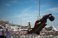 Formula One - Monaco Grand Prix - Monaco - 28/5/16. A crane lifts the car of Red Bull Racing's F1 driver Max Verstappen after his crash during the qualifying session. REUTERS/Andrej Isakovic/Pool TPX IMAGES OF THE DAY