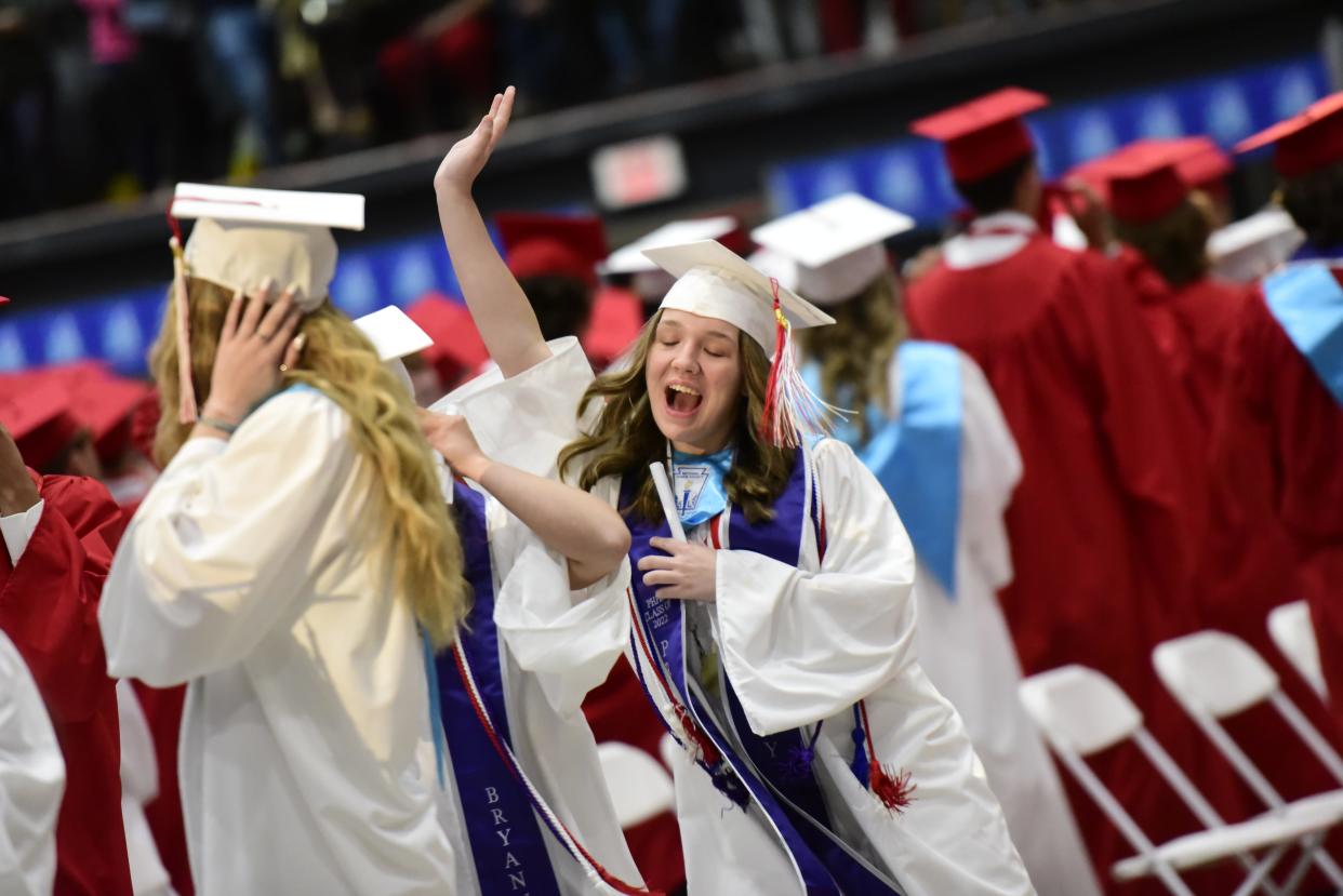 Graduating seniors begin to dance at the end of the playing of the school's fight song during the Port Huron High School commencement ceremony at McMorran Arena in Port Huron on Wednesday, June 8, 2022.