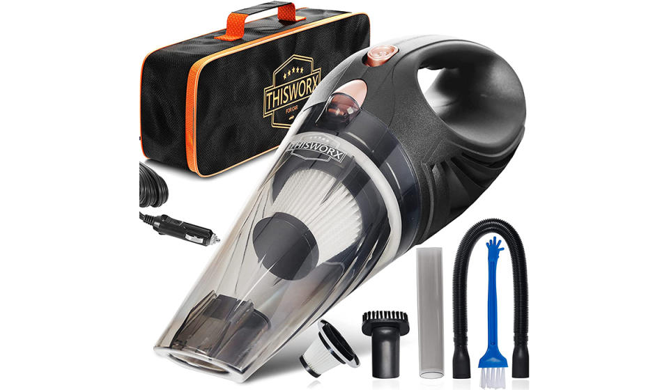 A small handheld vacuum cleaner along with accessories and a bag.