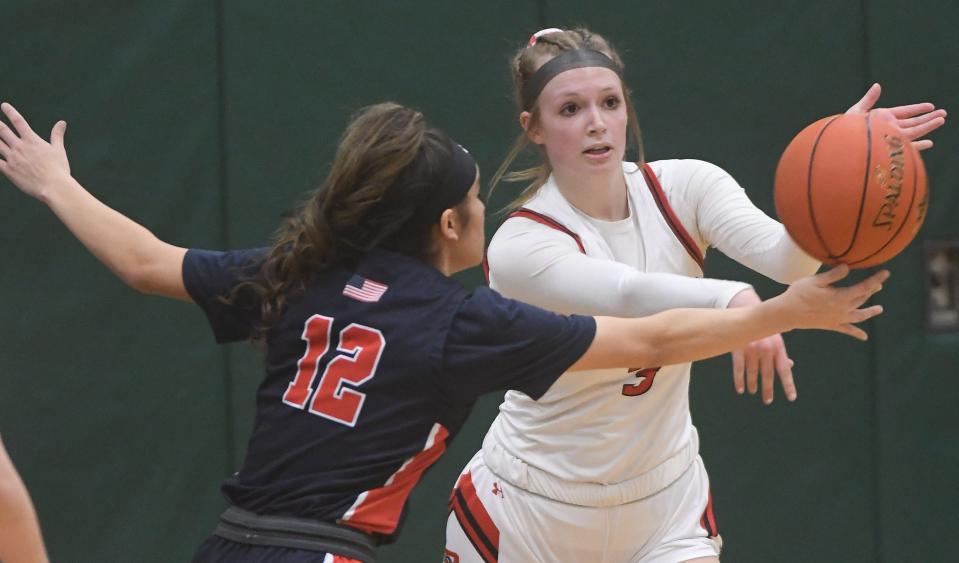 Selena Maldonado of Hornell gets a slight piece of the pass from Aynsley Belcher.