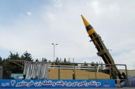 Iran unveils 2,000 km ballistic missile