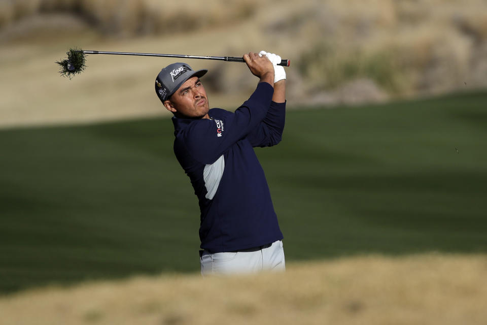 Rickie Fowler follows through on his shot from the 10th fairway during the second round of The American Express golf tournament on the Nicklaus Tournament Course at PGA West on Friday, Jan. 17, 2020, in La Quinta, Calif. (AP Photo/Marcio Jose Sanchez)