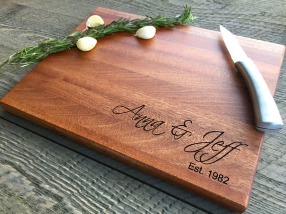 Whether it's a set of monogrammed wine glasses or an <a href="https://www.etsy.com/listing/519201195/custom-cutting-board-personalized?ga_order=most_relevant&amp;ga_search_type=all&amp;ga_view_type=gallery&amp;ga_search_query=&amp;ref=sr_gallery-1-16" target="_blank">engraved cutting board like this one from Etsy</a>, a personalized gift will mean so much to the happy couple.