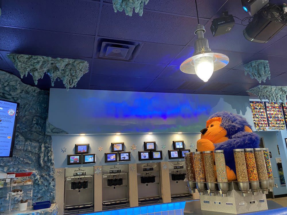 Interior of Arctic Ape Wild Desserts with cereal topping station and giant stuffed ape