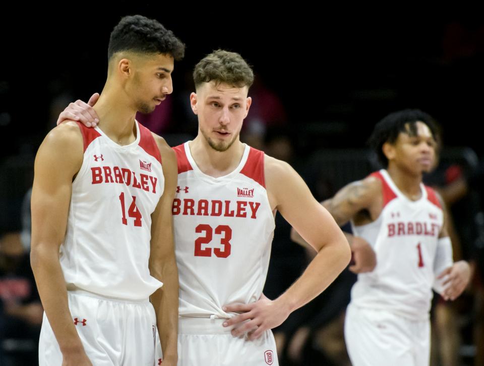 Bradley's Ville Tahvanainen (21) chats with teammate Malevy Leons (14) in the second half against SEMO on Saturday, Nov. 19, 2022 at Carver Arena.