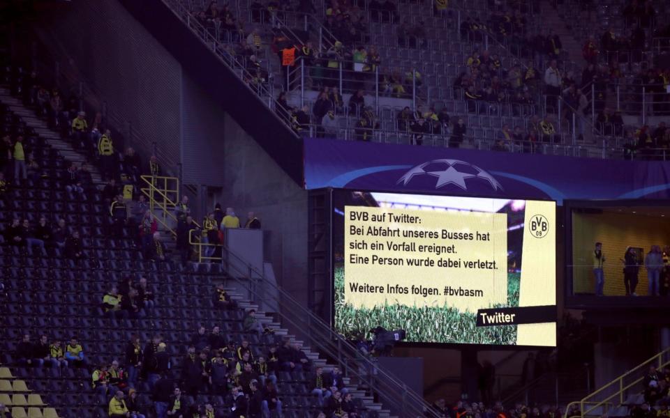 Message displayed on the big screen within the ground reads ' BVB of Twitter: Bei Abfahrt unseres Busses hat sich ein Vorfall ereignet. Eine Person wurde dabei verletzt. Weitere infos folgen.' 'BVB on Twitter: When we left our bus, an incident occurred. One person was injured. More information will follow - Credit: EMPICS Sport