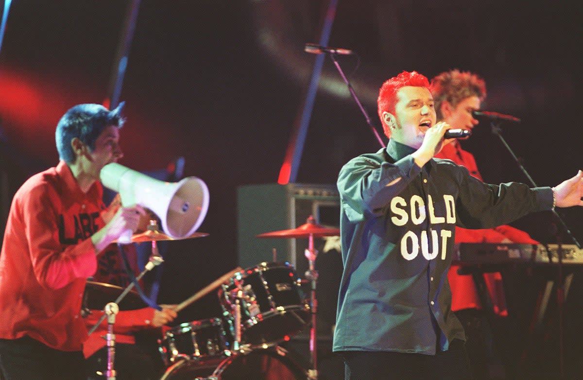 Chumbawamba perform their hit single 'Tubthumping' at start of Brit Awards ceremony at London Arena (PA)