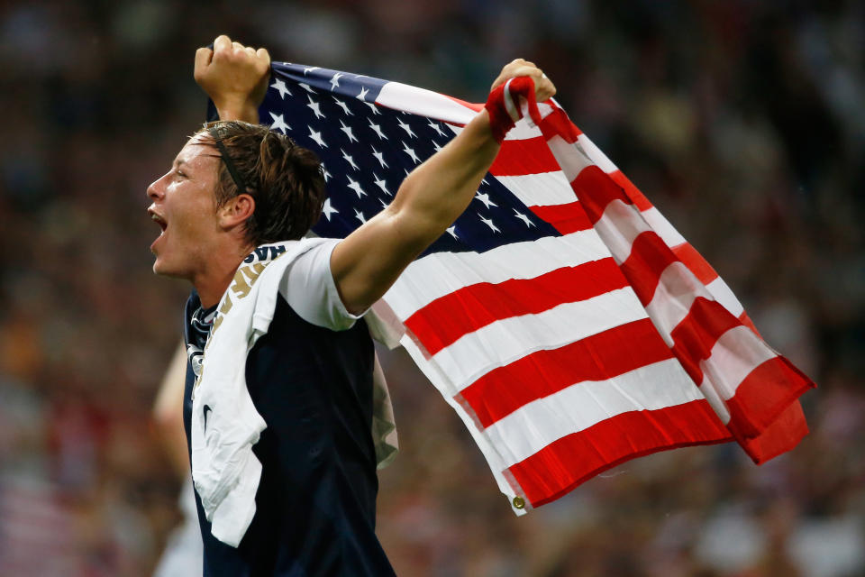 LONDON, ENGLAND - AUGUST 09: Abby Wambach #14 of the United States celebrates after defeating Japan by a score of 2-1 to win the Women's Football gold medal match on Day 13 of the London 2012 Olympic Games at Wembley Stadium on August 9, 2012 in London, England. (Photo by Jamie Squire/Getty Images)